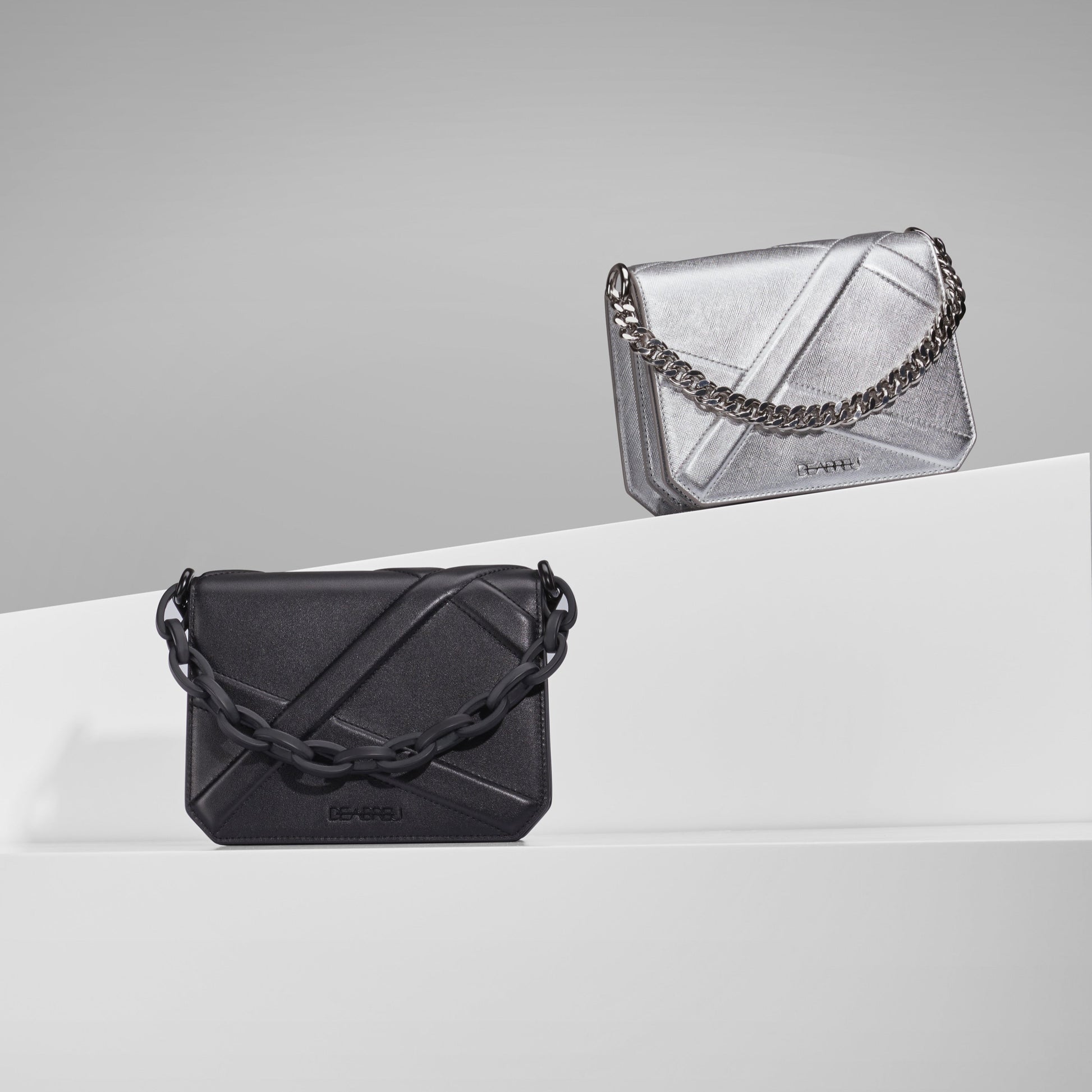 Close-up of acrylic chain and embossed leather on Black Cross Body Bag X-Line