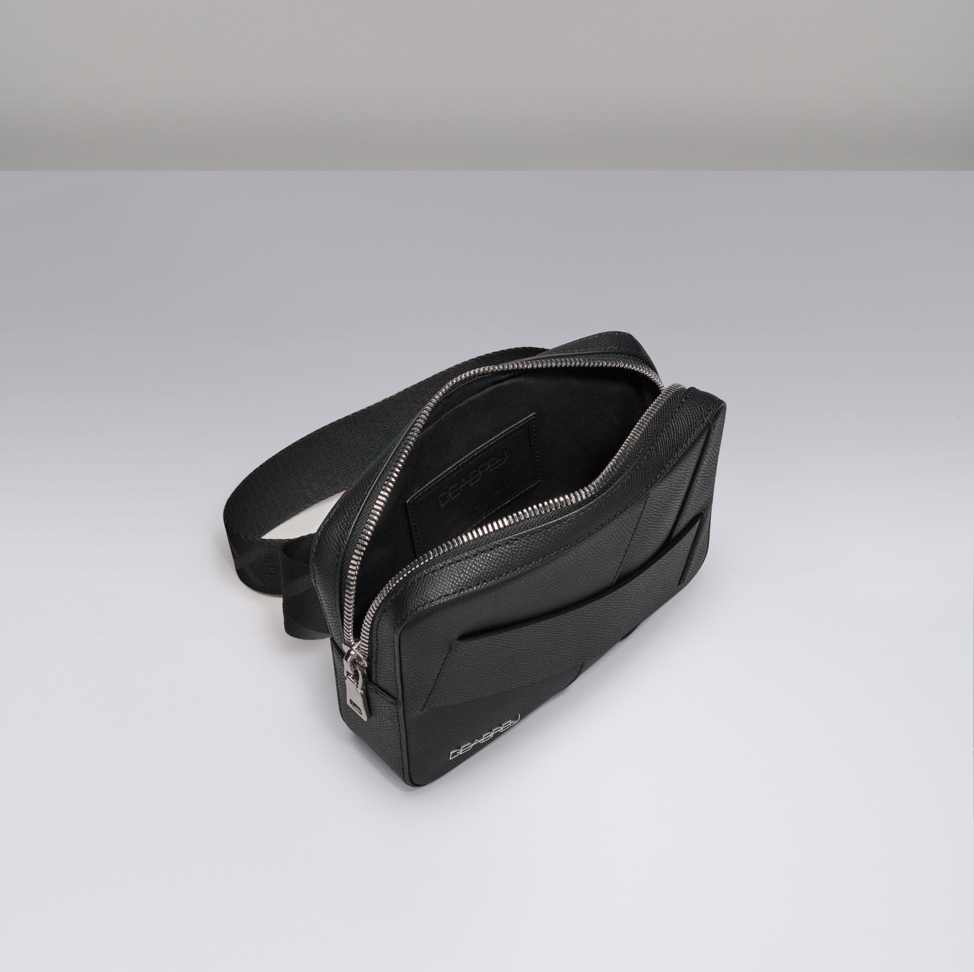 Interior of Deabreu Italy Black Saffiano Leather Crossbody Bag showing compartments