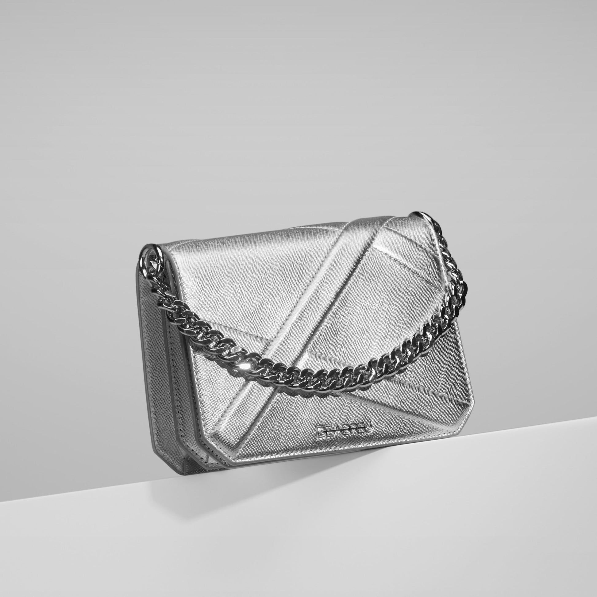 Side view of silver leather Cross Body Bag X-Line with acrylic and metal chain